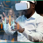 Programmation Assistée par IA à Madagascar révolutionnez votre développement avec WDATA MG Un homme équipé d’un casque de réalité virtuelle manipule des graphiques numériques, plongeant au cœur d’une expérience immersive où technologie et interaction se rencontrent | wdata-mg.info